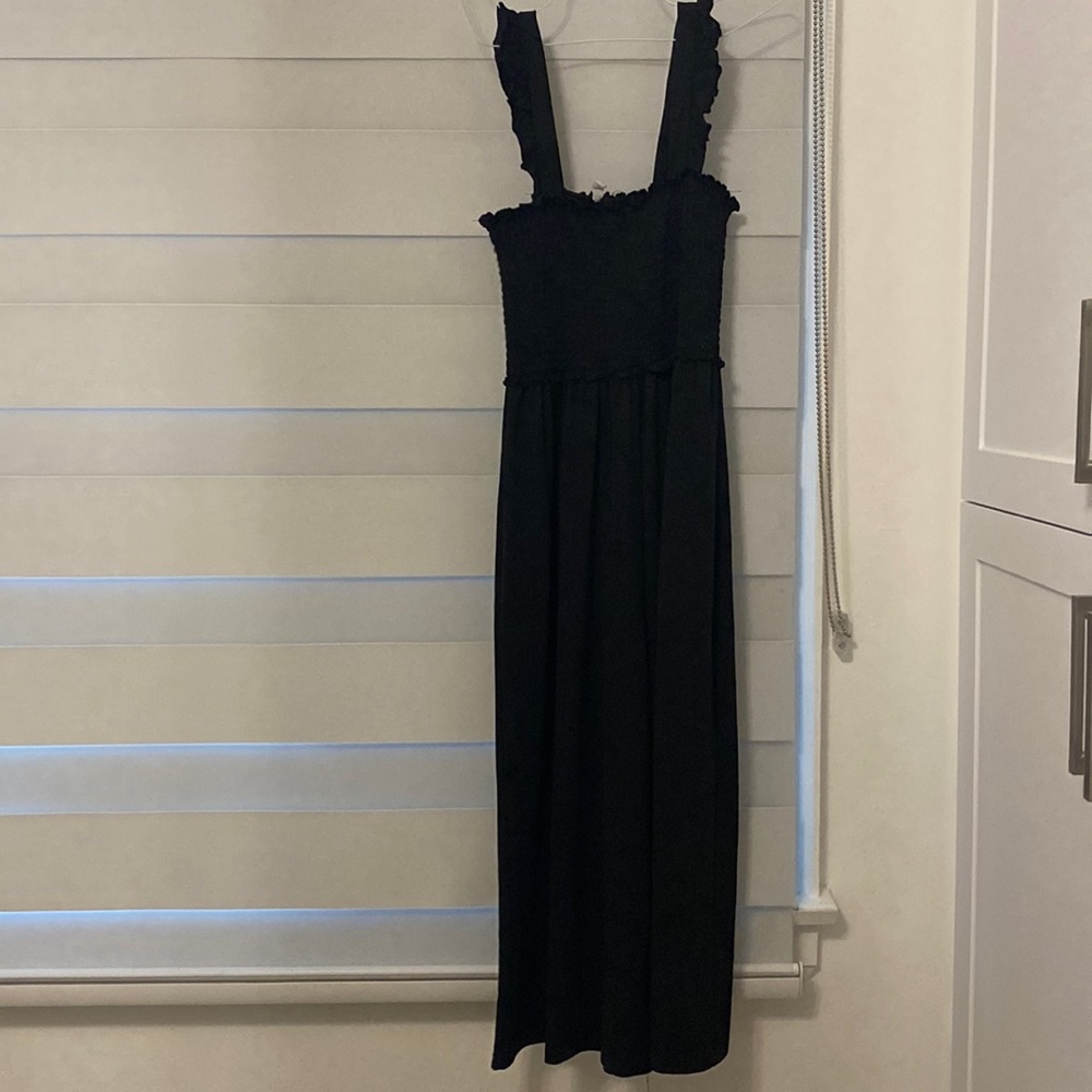Black jumpsuit with frilled straps